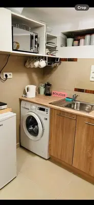 a kitchen with a washing machine and a sink at Old town Krakow in Kraków