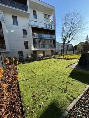 a grassy yard in front of a building at Jasna Elegancja in Kraków