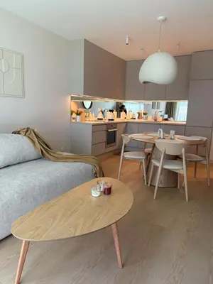 a living room with a couch and a table at Jasna Elegancja in Kraków