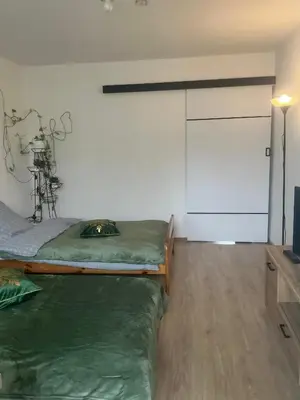 a bedroom with a bed and a tv in it at Stacja kolejowa Kraków Płaszów in Kraków
