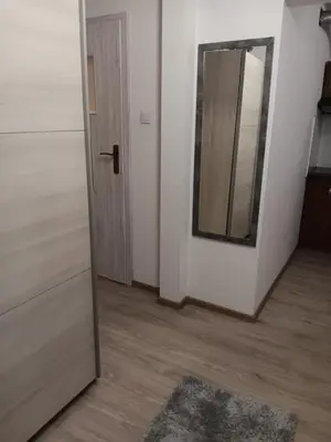 a room with a mirror and a door with a rug at Stacja kolejowa Kraków Płaszów in Kraków