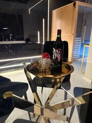 a table with a bottle of wine on top of it at Anielski Apartament z jacuzzi i sauną NOWY 2 sypialnie Relaks & SPA in Kraków