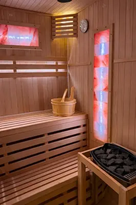 a sauna with a wooden tub and a stove at Anielski Apartament z jacuzzi i sauną NOWY 2 sypialnie Relaks & SPA in Kraków