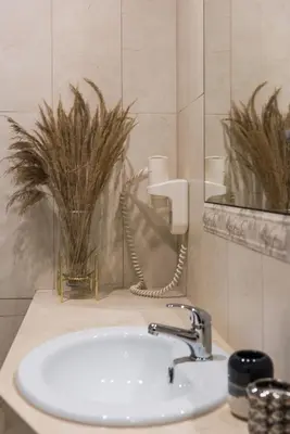a white sink in a bathroom with a mirror at Gentle Glow Suite by Tyzenhauz in Kraków