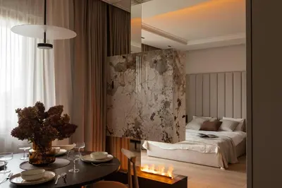a bedroom with a bed and a table with a dining room at Panoramic Landmark View City Center FREE Parking in Kraków