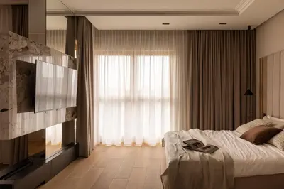 a bedroom with a bed and a large window at Panoramic Landmark View City Center FREE Parking in Kraków