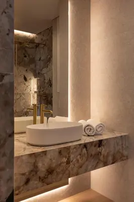 a bathroom with a sink and a mirror at Panoramic Landmark View City Center FREE Parking in Kraków