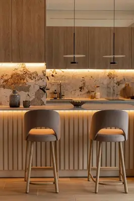 a kitchen with a counter with two chairs and a table at Sunset Balcony City Center Free Parking in Kraków