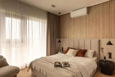 a bedroom with a bed with two shoes on it at Panorama suite City Center Main Station in Kraków
