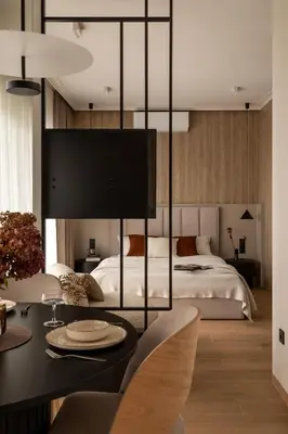 a bedroom with a bed and a table with a dining room at Panorama suite City Center Main Station in Kraków