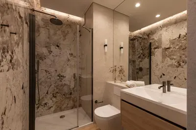 a bathroom with a sink toilet and a shower at Panorama suite City Center Main Station in Kraków