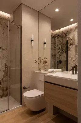 a bathroom with a toilet and a sink and a shower at Panorama suite City Center Main Station in Kraków