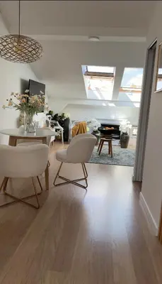 a living room with white chairs and a table at The perfect cozy Oasis in Kraków