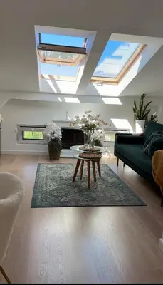 a living room with skylights and a coffee table at The perfect cozy Oasis in Kraków