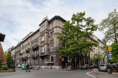 a large building on a city street with at Paulińska 30 Kraków Spacious Apartment Kazimierz in Kraków