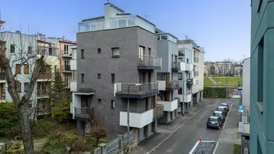 an apartment building with balconies on a city street at Cracow Vistula Harmony Apartment by BookingHost in Kraków