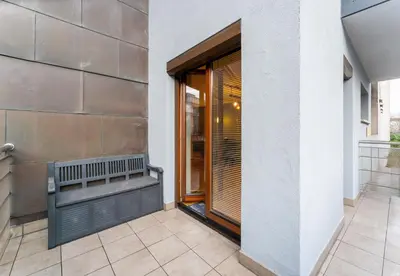 a balcony of a building with a window at Cracow Vistula Harmony Apartment by BookingHost in Kraków