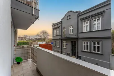 an apartment balcony with a view of a building at Cracow Vistula Harmony Apartment by BookingHost in Kraków