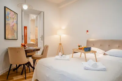 a kitchen with a sink and a bottle of wine at Design Apartment Kazimierz, Old Town Area in Kraków