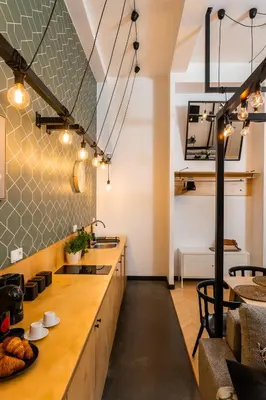 a living room with a bed and tables and chairs at Old Town Loft Designed with Love in Kraków
