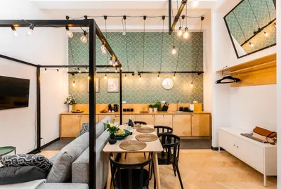 a living room with a couch and a table at Old Town Loft Designed with Love in Kraków