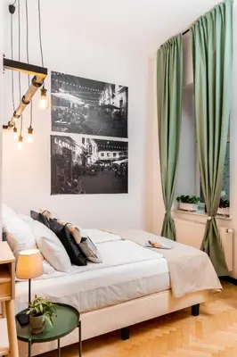 a living room with a table and a couch at Old Town Loft Designed with Love in Kraków