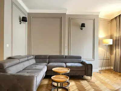 a living room with a couch and a table at Premium Apartment for 6 guests city center with 2 bedrooms and living room in Kraków