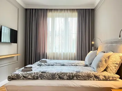 a bedroom with a bed in front of a window at Premium Apartment for 6 guests city center with 2 bedrooms and living room in Kraków