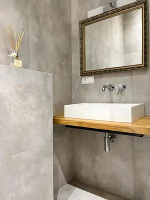 a bathroom with a white sink and a mirror at Premium Apartment for 6 guests city center with 2 bedrooms and living room in Kraków