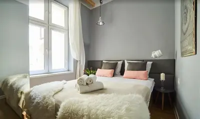 a bathroom with a sink and a shower at Krowoderska Comfort Apartments - by Upstairs in Kraków