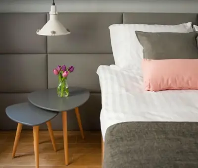 a living room with a brick wall at Krowoderska Comfort Apartments - by Upstairs in Kraków