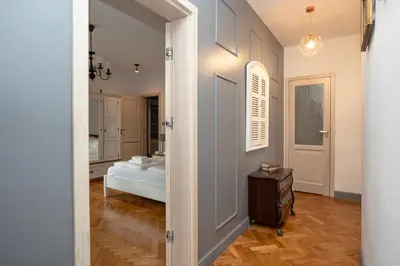 a hallway with a door leading to a bedroom at Wroblewskiego No 4 Residence in Kraków