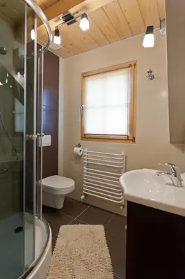 a bathroom with a sink and a toilet and a shower at Gorczański Domek - Koninki in Poręba Wielka