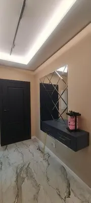 a room with a mirror and a black door at Apartament Wiślane Tarasy in Kraków