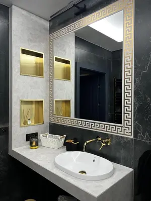 a bathroom with a sink and a large mirror at Apartament Wiślane Tarasy in Kraków