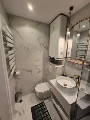 a white bathroom with a toilet and a sink at Wawel View 31, Kazimierz # Netflix # Air Conditioning # in Kraków