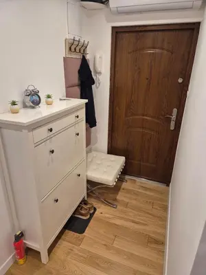 a bathroom with a dresser and a wooden door at Wawel View 31, Kazimierz # Netflix # Air Conditioning # in Kraków