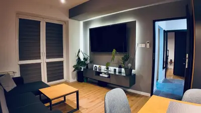 a living room with a couch and a table at Płaszowska Apartments in Kraków