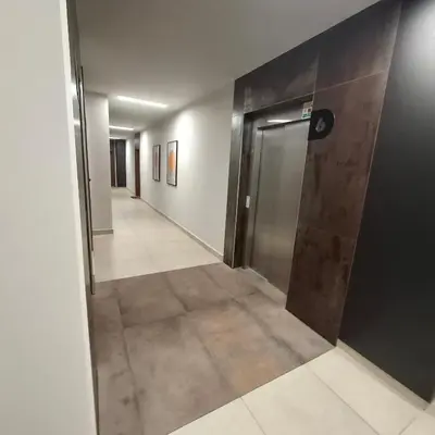 an empty hallway with a door in a building at Krakow Apartment in Kraków