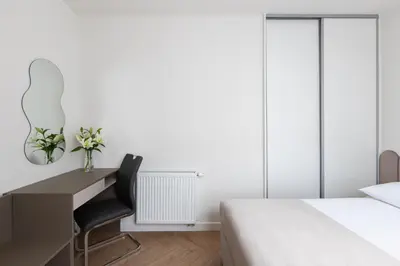 a bedroom with a desk and a bed at Native Apartments Prądnicka 48 in Kraków