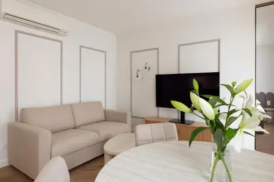 a living room with a couch and a table at Native Apartments Prądnicka 48 in Kraków