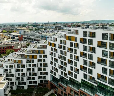 an aerial view of a white apartment building at Apartamenty w centrum Krakowa, parking w cenie in Kraków