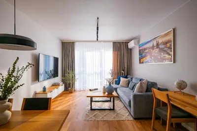 a living room with a couch and a table at Apartamenty w centrum Krakowa, parking w cenie in Kraków
