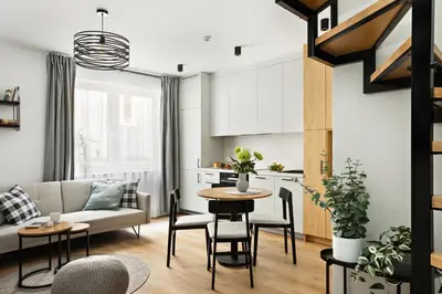 a living room with a couch and a table at Berka 12 - Quiet Two-Level Apartment in Kraków