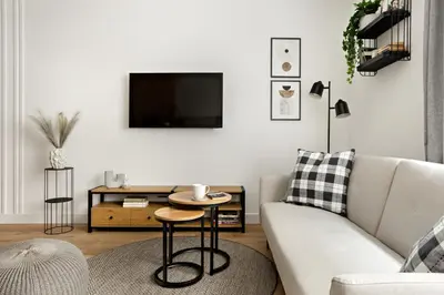 a living room with a couch and a table at Berka 12 - Quiet Two-Level Apartment in Kraków