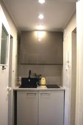 a kitchen with a sink and a counter top at Arras Studio with Wawel Castle view, WiFi in Kraków