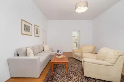 a living room with two couches and a coffee table at Heart of the City Apartments Market Square Cracow by Noclegi Renters in Kraków