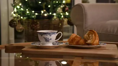 a table with a coffee cup and croissants on it at Hygge Beskid in Lachowice