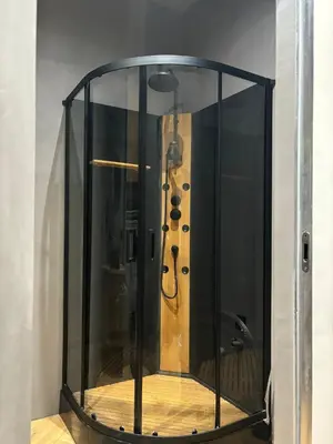 a shower in a room with a guitar in it at Cozy Studio near Central Station Krakow in Kraków