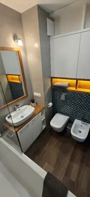 a bathroom with two sinks and a mirror at Blue Angel Apartment in Kraków